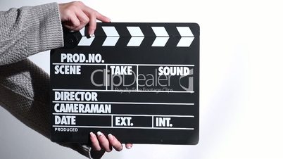 Woman hands holding film clapper
