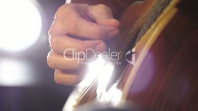 Detail of a guitarist playing classical guitar