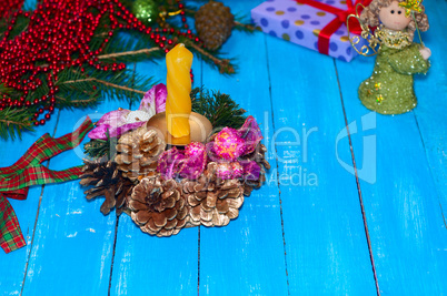 Christmas decoration for the house with a yellow candle