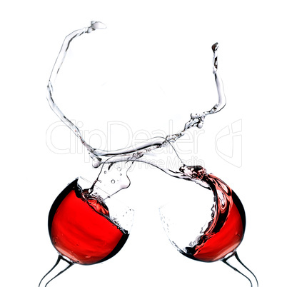 Two splashing wine glasses