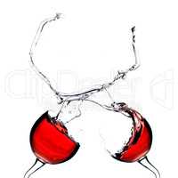 Two splashing wine glasses