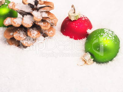 Christmas background with old baubles and pinecone