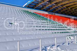 Background chairs at stadium , winter