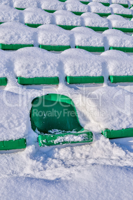 Background chairs at stadium , winter