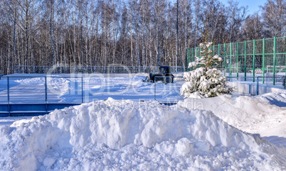 Removing snow from the pitch