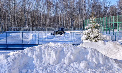 Removing snow from the pitch