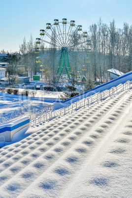 City park, covered with snow on a clear winter day