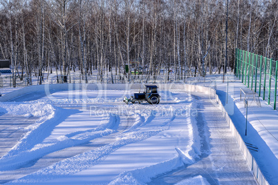 Removing snow from the pitch