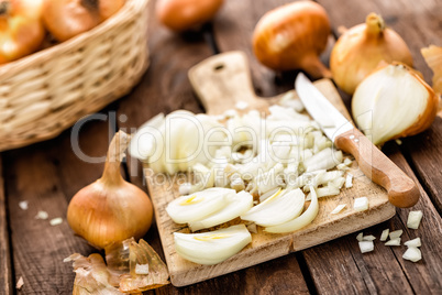 raw onion chopped on wooden board