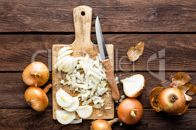 raw onion chopped on wooden board