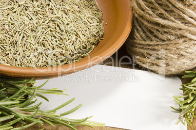 Fresh rosemary and a bowl with dried