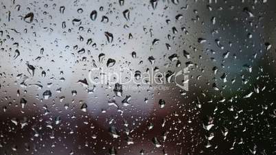Sadness written on rainy window