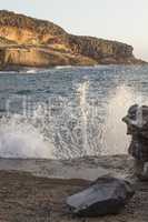 Wave splashing at rocky shore