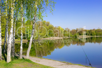 Large beautiful lake, with banks overgrown with forest.