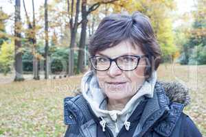 Woman enjoys the autumn wood