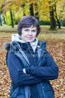 Woman enjoys the autumn wood