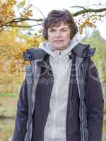 Woman enjoys the autumn wood