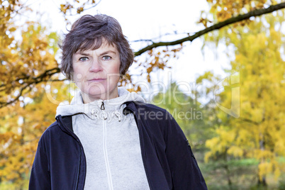 Woman enjoys the autumn wood