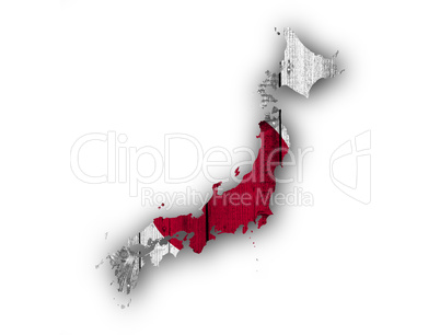 Karte und Fahne von Japan auf verwittertem Holz
