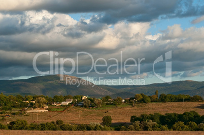 Thick clouds over a green valley with mountains Baydarskaya