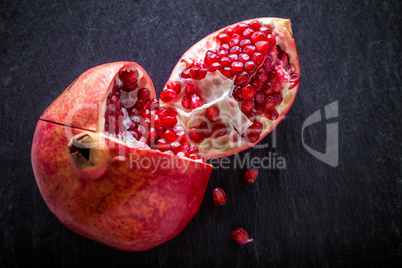 Pomegranate on a stone plate