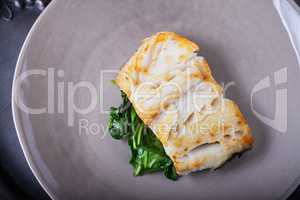 Fried cod fillets and spinach