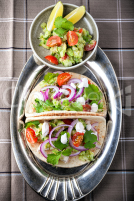 Chicken Tacos with vegetables served on the table
