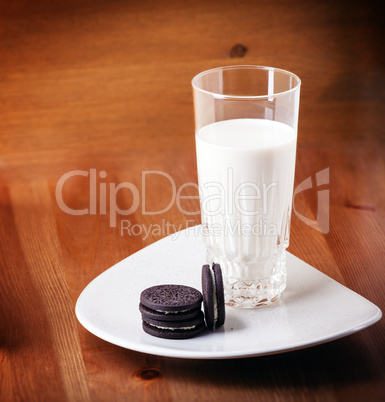 Milk and cookies on a wooden table