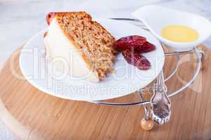 Slice of date cake on a white plate