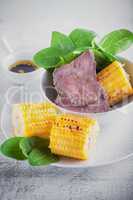 Beef and grilled corn