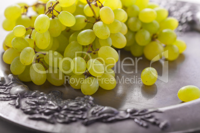 Bunch of white grapes on a tray