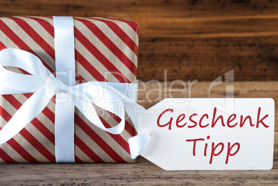 Present With Label, Geschenk Tipp Means Gift Tip