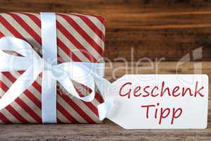 Present With Label, Geschenk Tipp Means Gift Tip