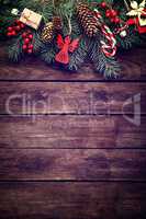 Christmas fir tree with decoration on dark wooden background