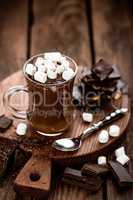 hot chocolate dessert with marshmallows on wooden background