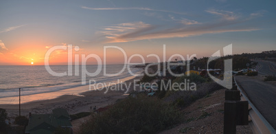 Cottages along Crystal Cove Beach at sunset