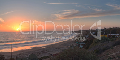 Cottages along Crystal Cove Beach at sunset