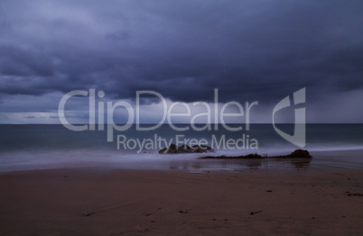 Rain clouds approach Crystal Cove Beach from the ocean