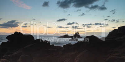 Rain clouds over Crescent Bay at sunset