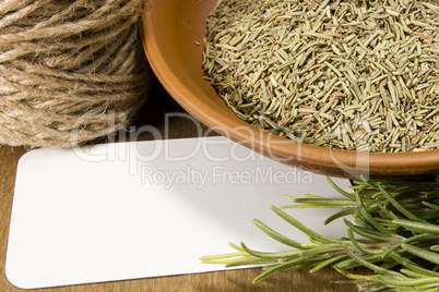 Fresh rosemary and a bowl with dried