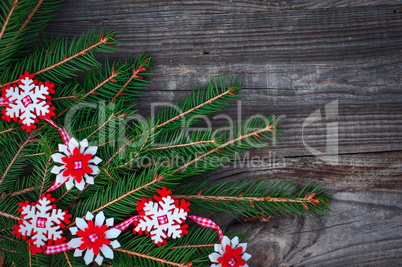 New Year's and Christmas wooden background with decorations and spruce branches