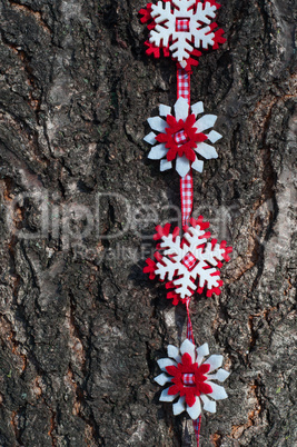 Snowflakes of felt on a red ribbon