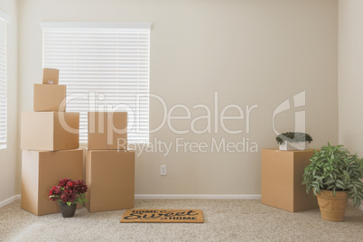 Variety of Packed Moving Boxes In Empty Room