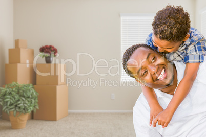 Mixed Race African American Father and Son In Room with Packed M