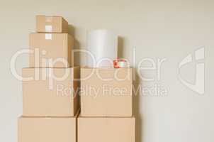 Variety of Packed Moving Boxes In Empty Room