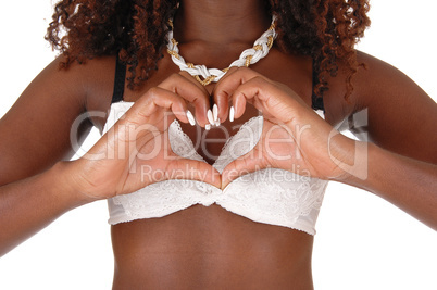 Black woman making heard with hand's.