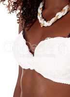 Closeup of black woman in white bra.