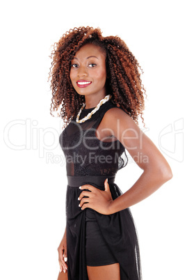 Smiling woman in black dress.