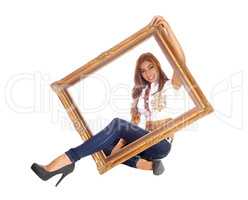 Woman sitting with picture frame.