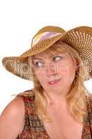 Blond woman with a straw hat.